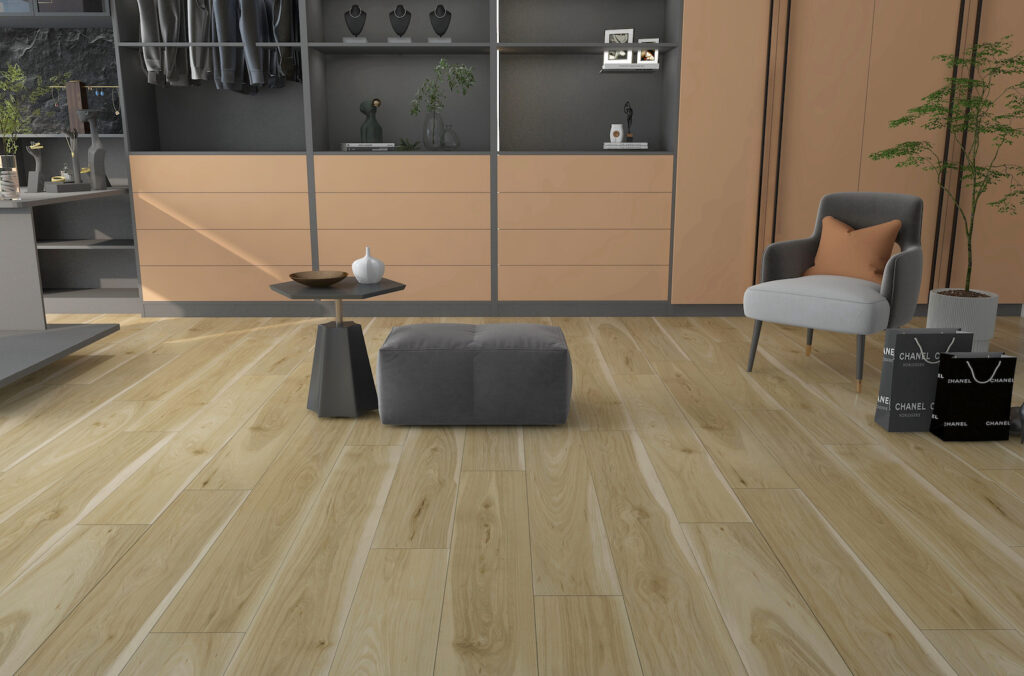 Modern living space featuring light hardwood flooring, a gray ottoman, a stylish chair, and a minimalist coffee table. Organized storage enhances the contemporary design.