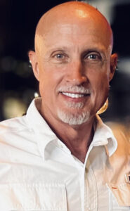 Smiling man with a bald head